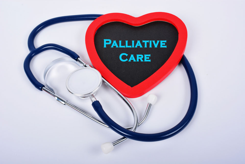 Stethoscope and red love with medical conceptual text "Palliative Care"